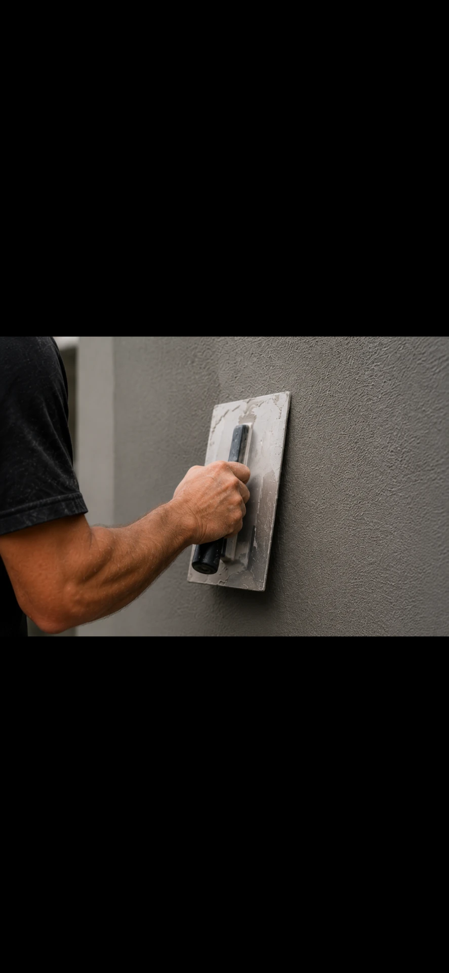 Applying a protective coating to a rendered wall